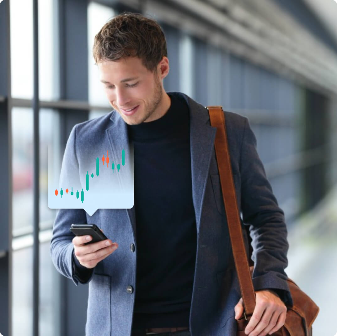 Man trading forex on mobile phone